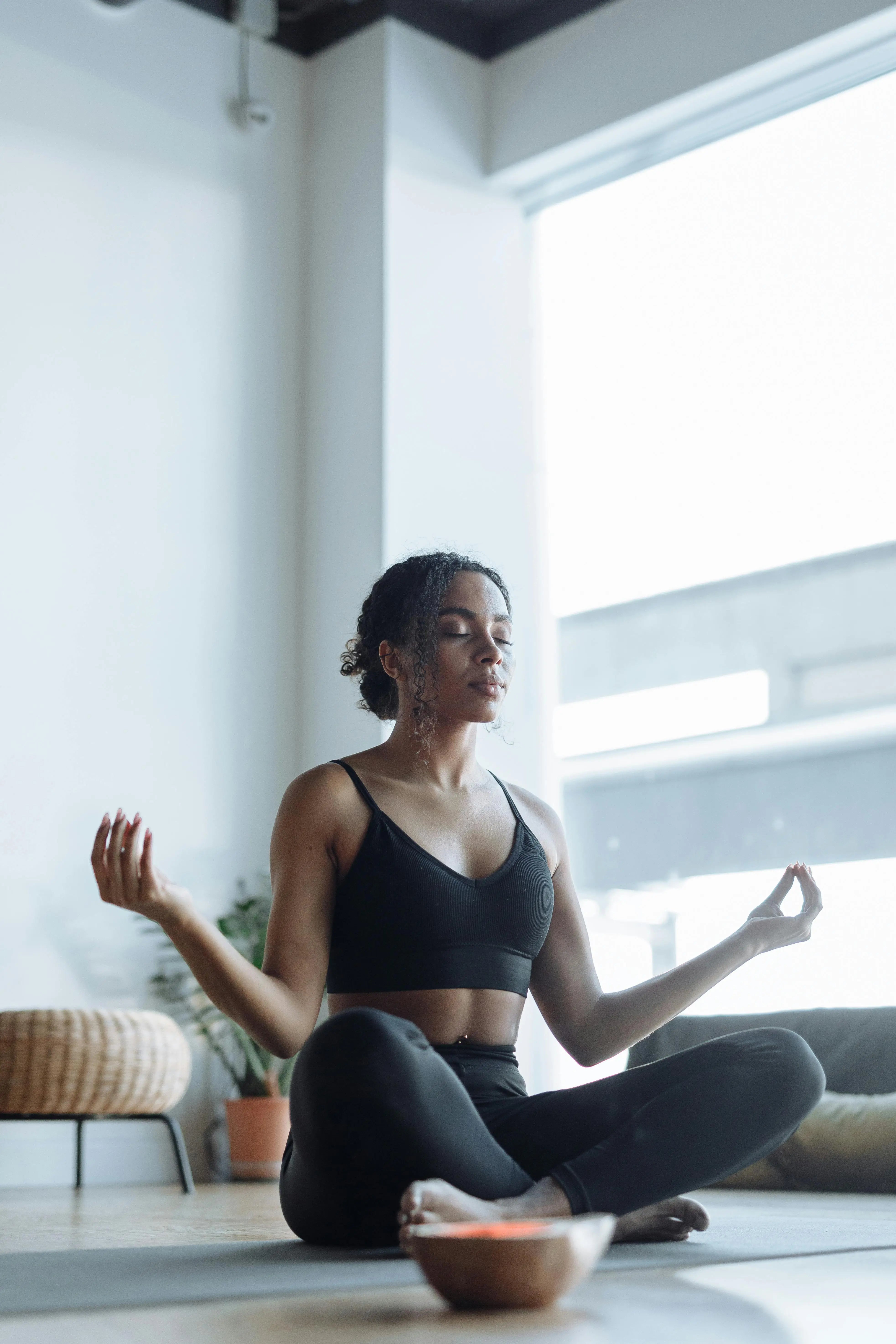 Calm home meditation session representing holistic wellness habits commonly combined with multivitamin use for women